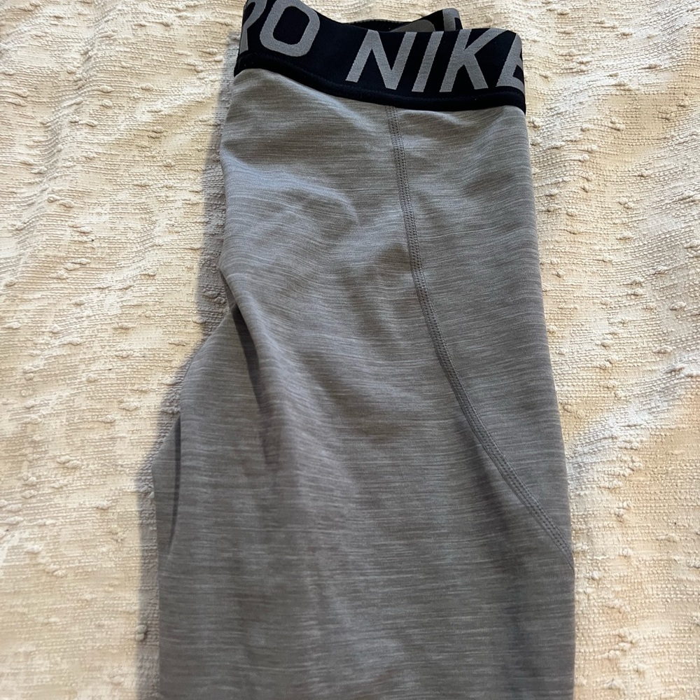 Nike pro leggings with mesh bottom detail